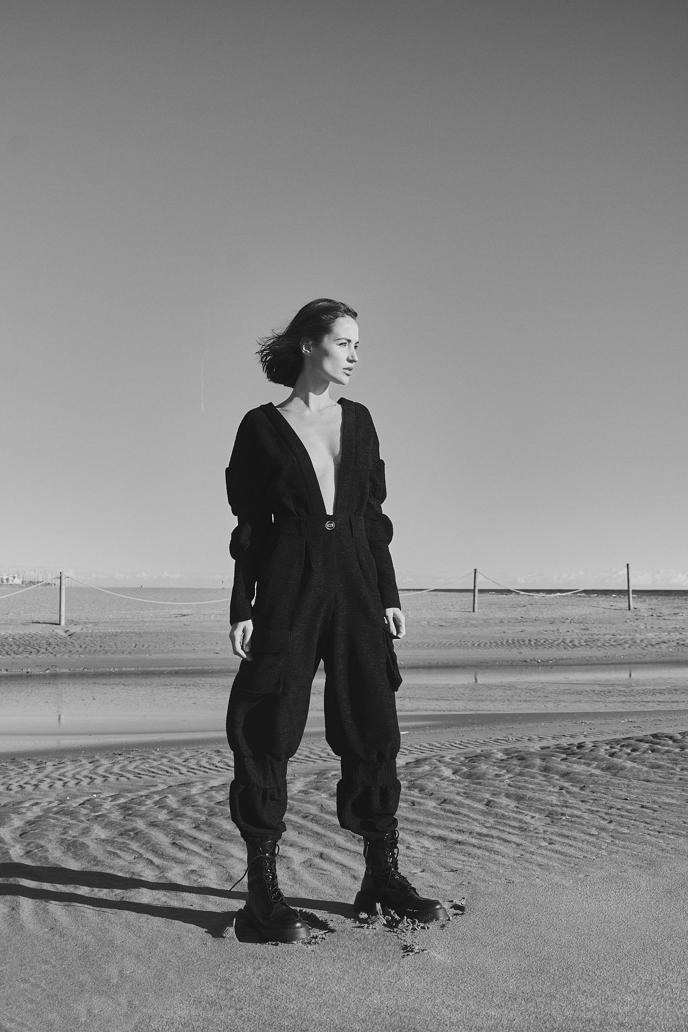 Black and white fashion editorial photographed on Castelldefels beach near Barcelona