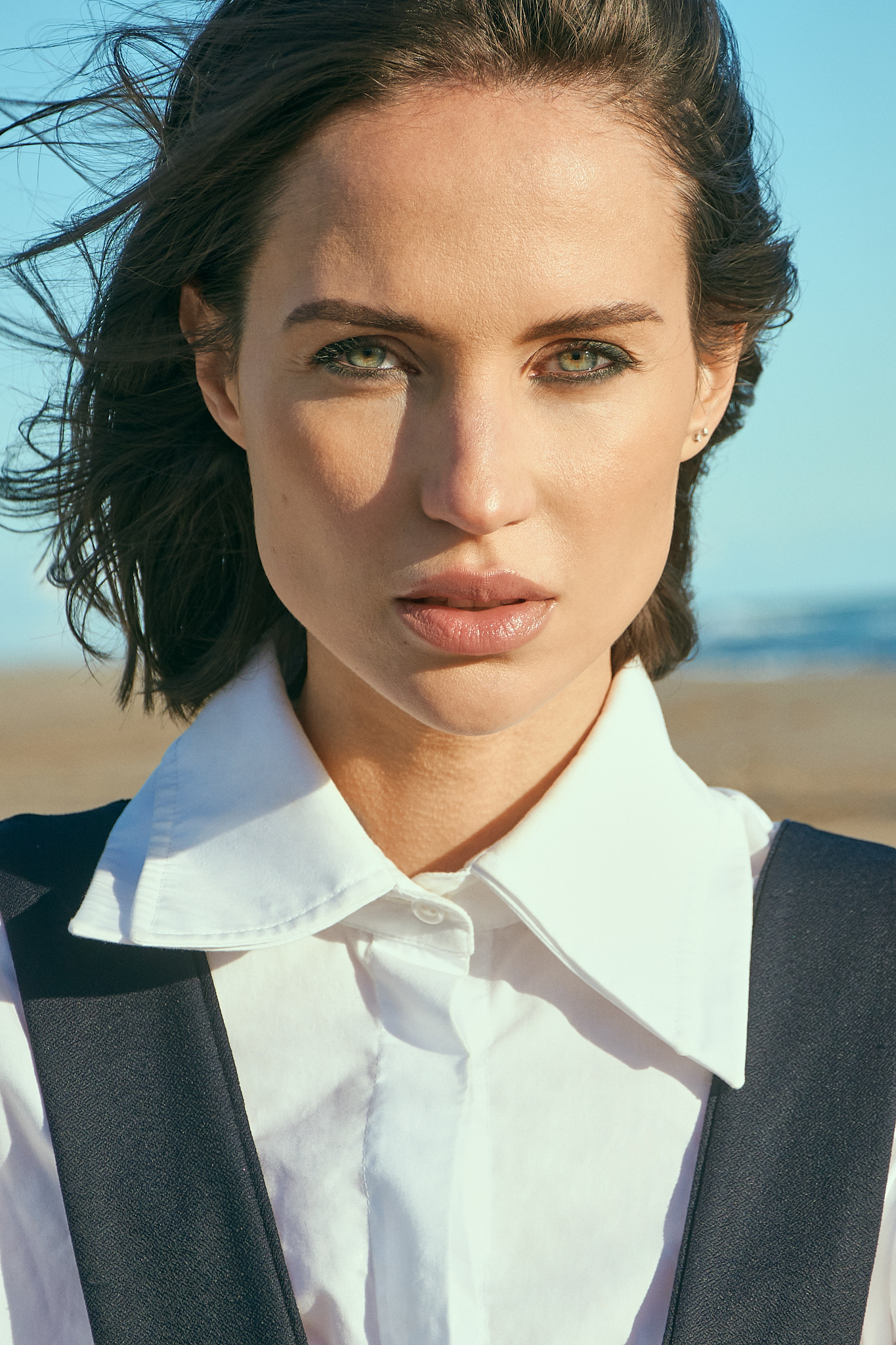 Fashion model portrait on Castelldefels beach for coastal fashion editorial near Barcelona