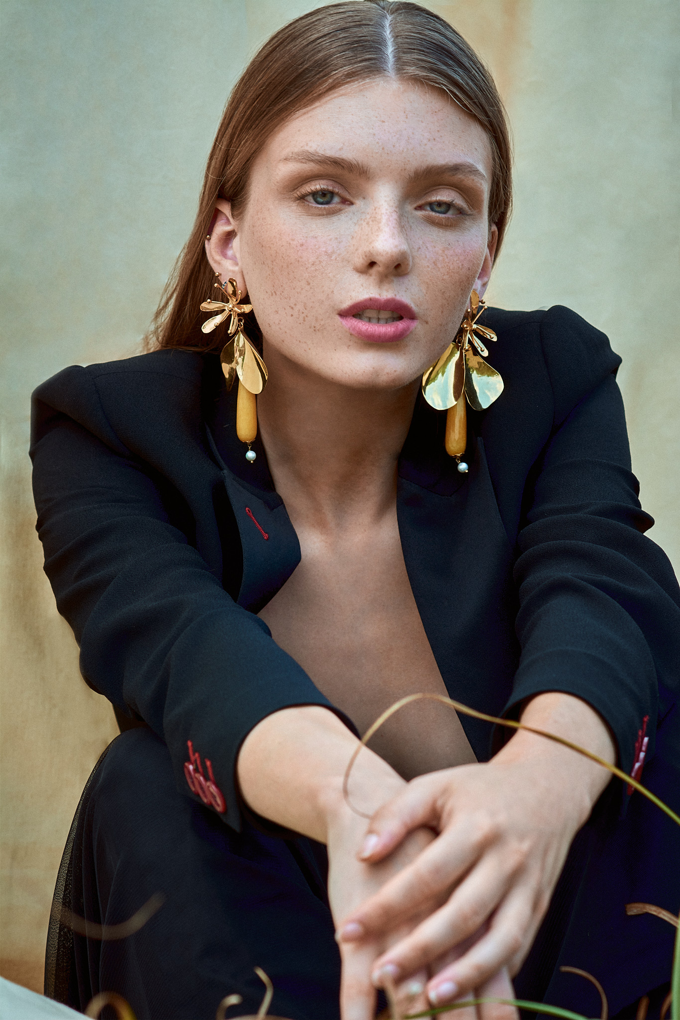 fashion editorial portrait model wearing dark tailoring natural light