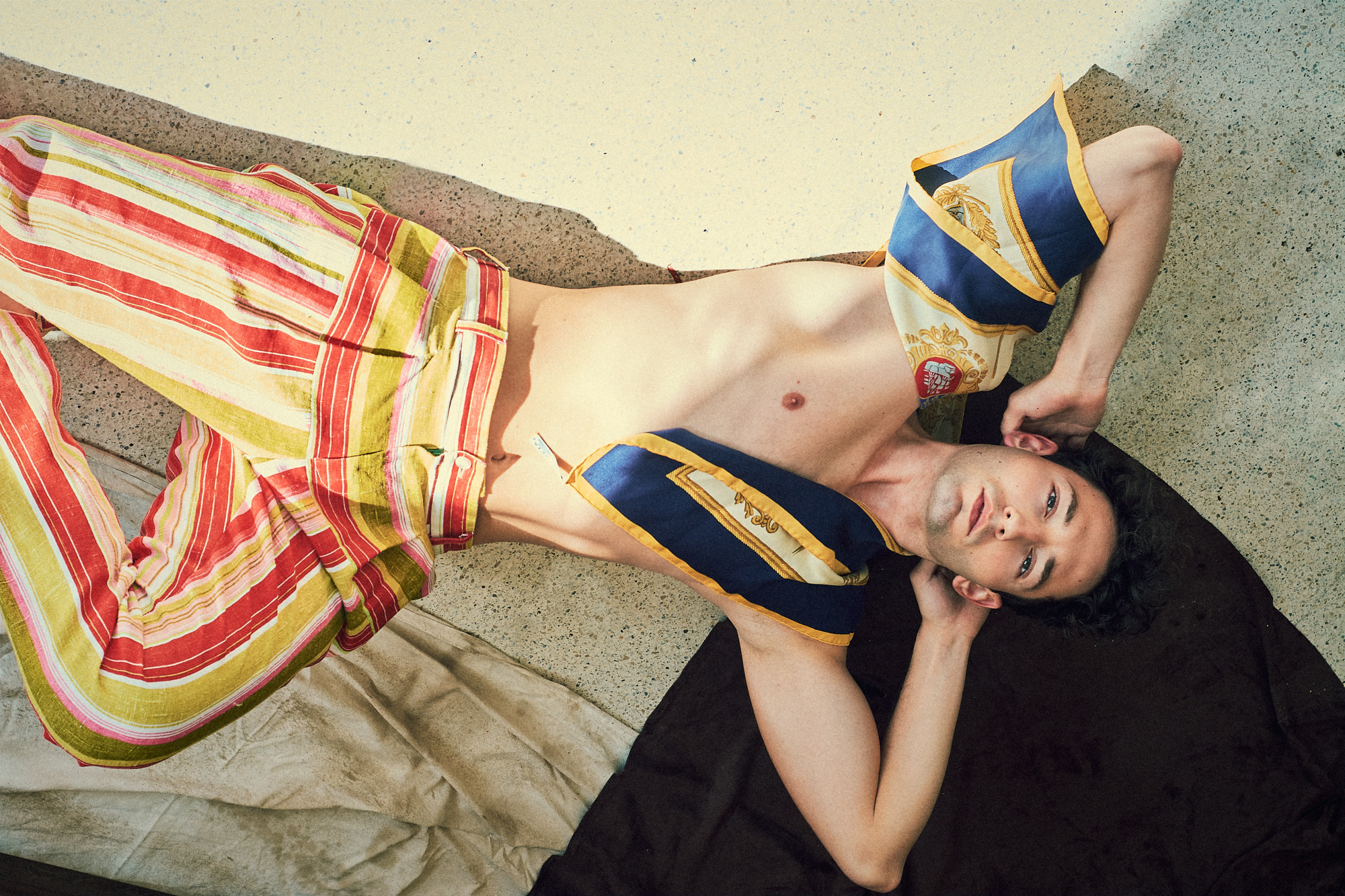 fashion editorial reclining portrait colorful tailoring styling