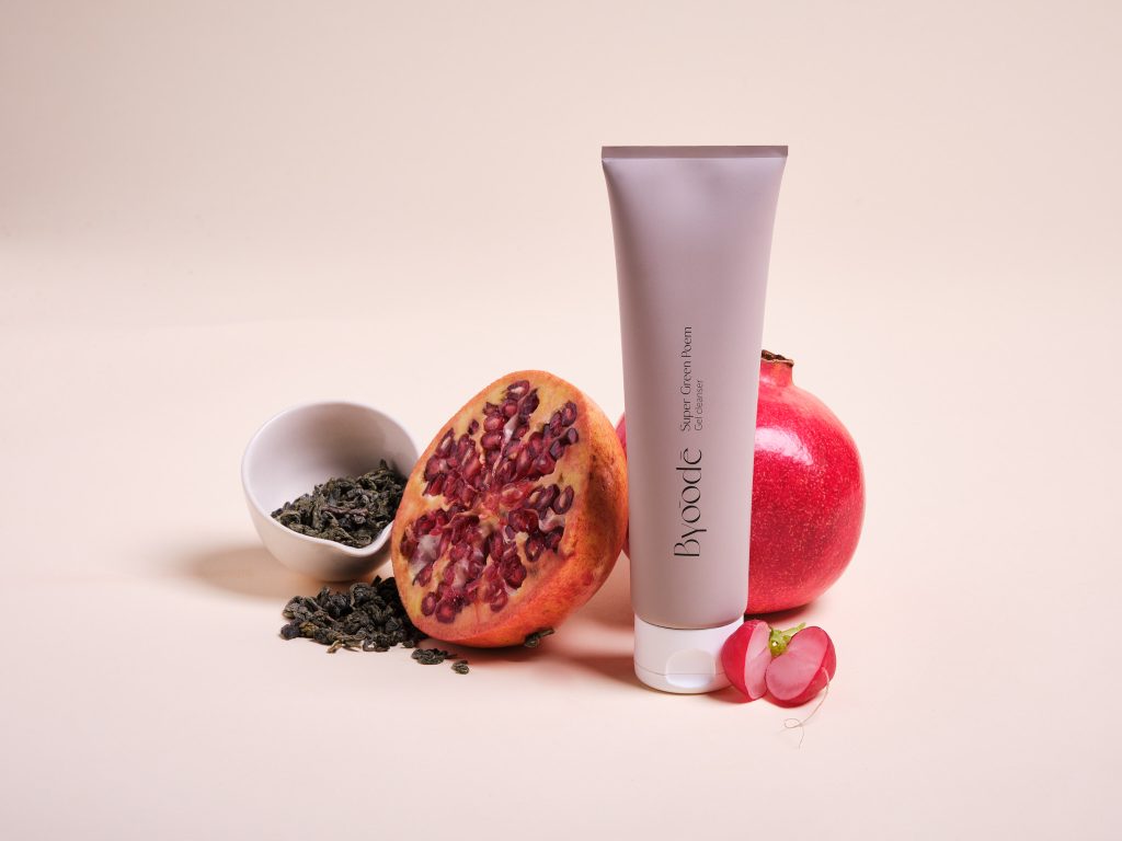 Byoode skincare tube with fruit ingredients — product photography for Moodka
